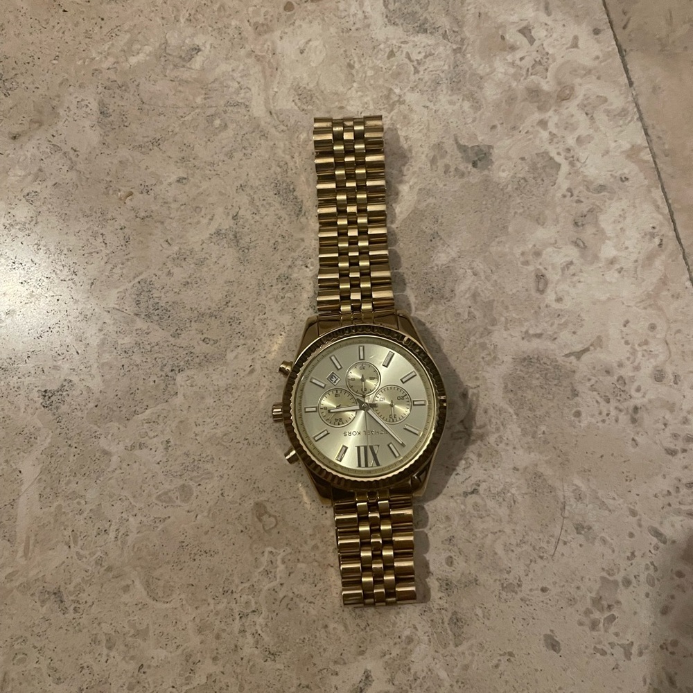 Gold men’s Michael kors watch